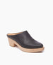 Coclico Kule Clog in Black leather a slip-on mule, tapered toe, mid-height solid wood base in an angled view.  2