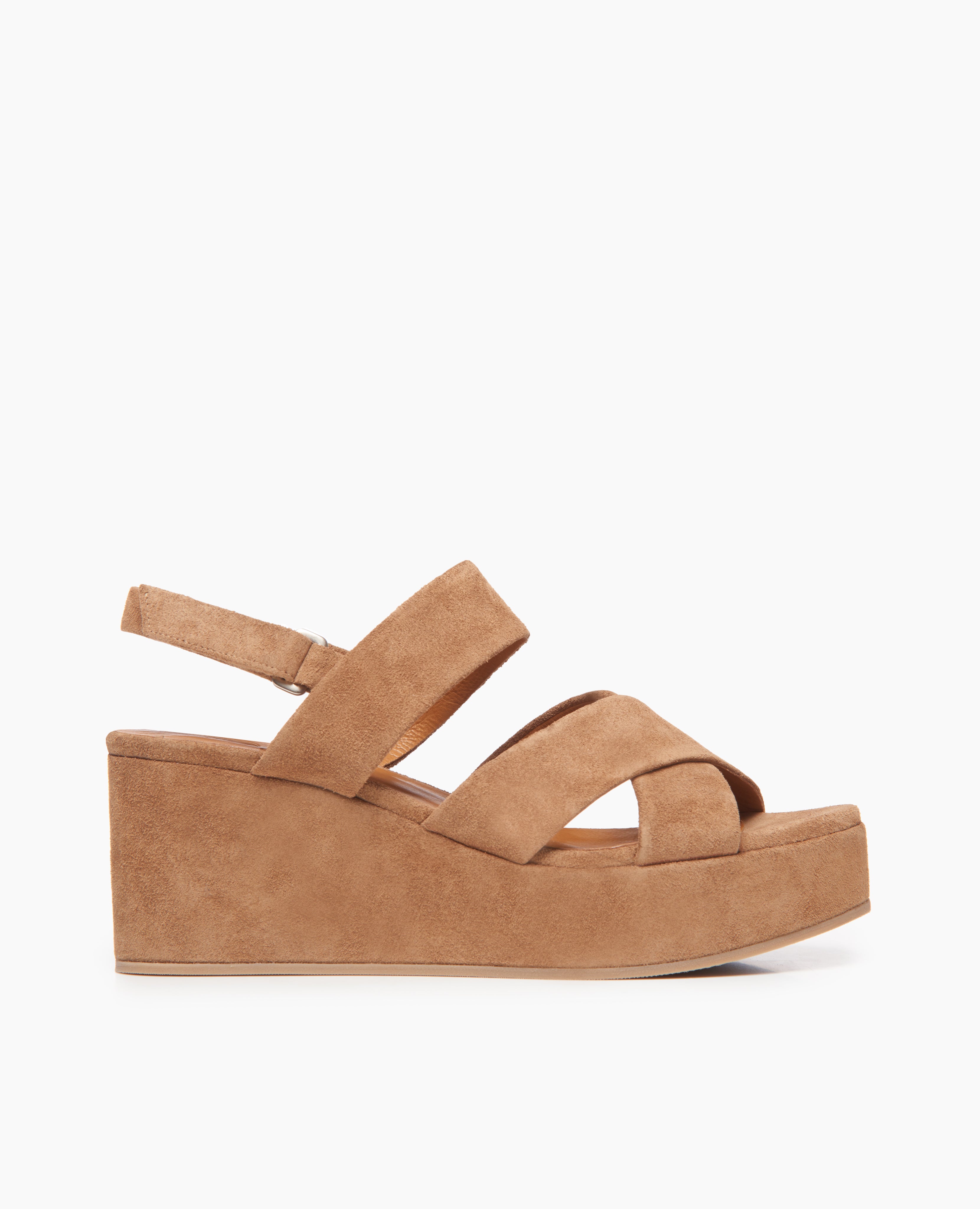 Side view of Coclico Lacine Wedge in Tobacco suede: Open crisscrossed toe strap sandal on a recycled cork wedge covered in suede leather, back strap, velcro closure. 