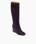 Angled view of the Lloyd Boot in Amethyst Suede: featuring a dark stained, solid-wood, sculpted, and inset wedge. Partial inside-zip. 2