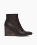 Side view of the Lodi Boot in Black; featuring a solid-wood, sculpted, and inset wedge. Inside zip closure. 1