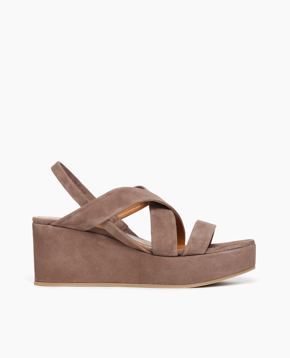 Side view of Coclico Lylo Wedge in Smoke suede: suede wrapped cork wedge, elasticated slingback strap, crisscrossed straps across foot.