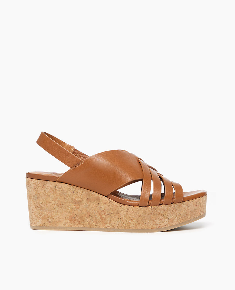 Side view of Coclico Moska Wedge in Cuoio leather a Huarache inspired cork wedge with a woven leather band across foot, slingback strap. 