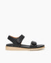 Coclico Peeper Sandal in Deep Sea leather: a two-strap, low pine wedge sandal with leather-wrapped footbed, gum-rubber sole. Velcro closure. Side view.  1