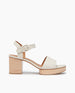 Side view Coclico Riviera Clog in Greige (off-white) leather: quarter-strap, wide front band, buckle closure, with a solid wood platform to match the solid wood mid-height heel. 1