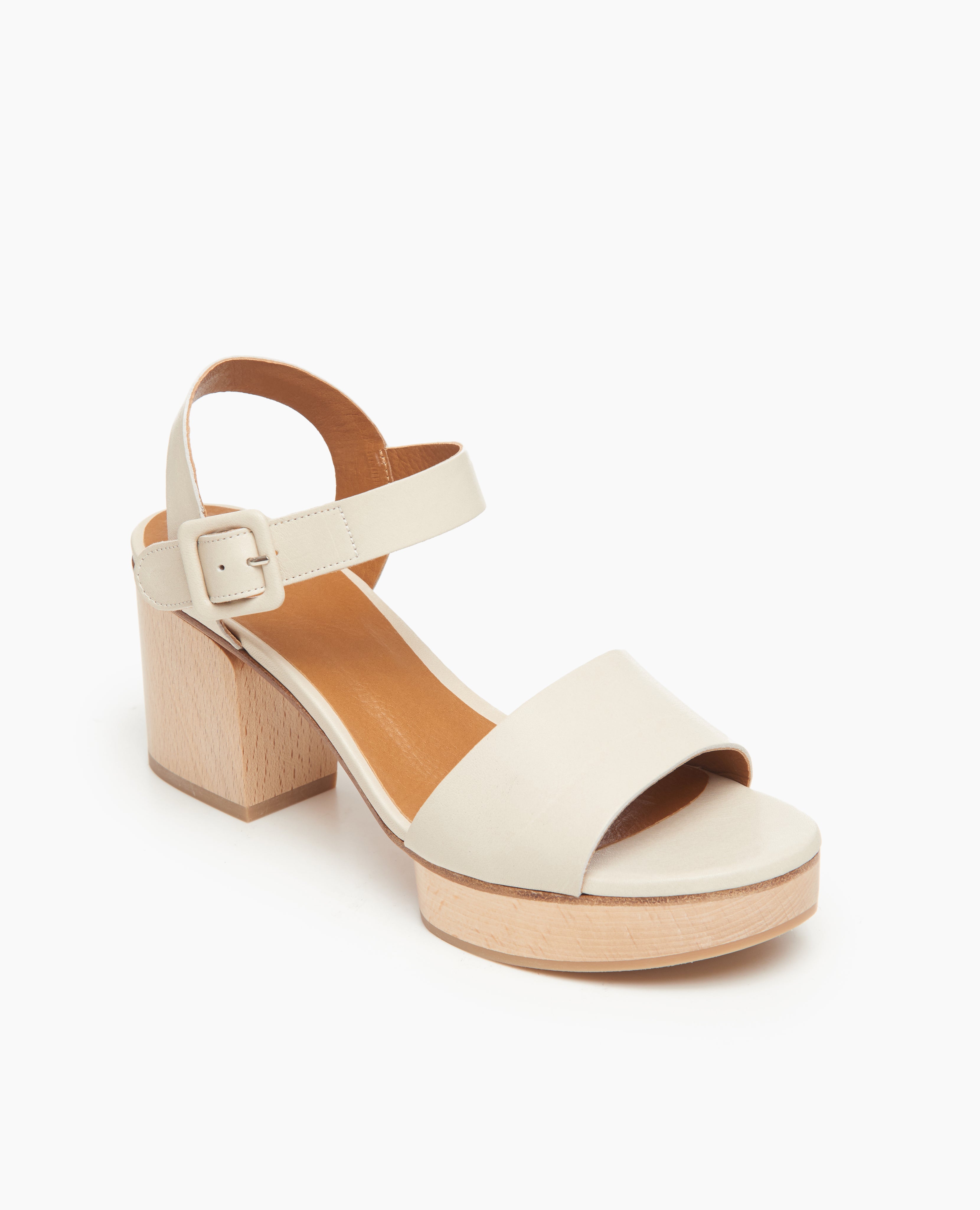Coclico Riviera Clog in Greige (off-white) leather, angle view: wide front band, quarter-strap, buckle closure, with a solid wood platform to match the solid wood mid-height heel.