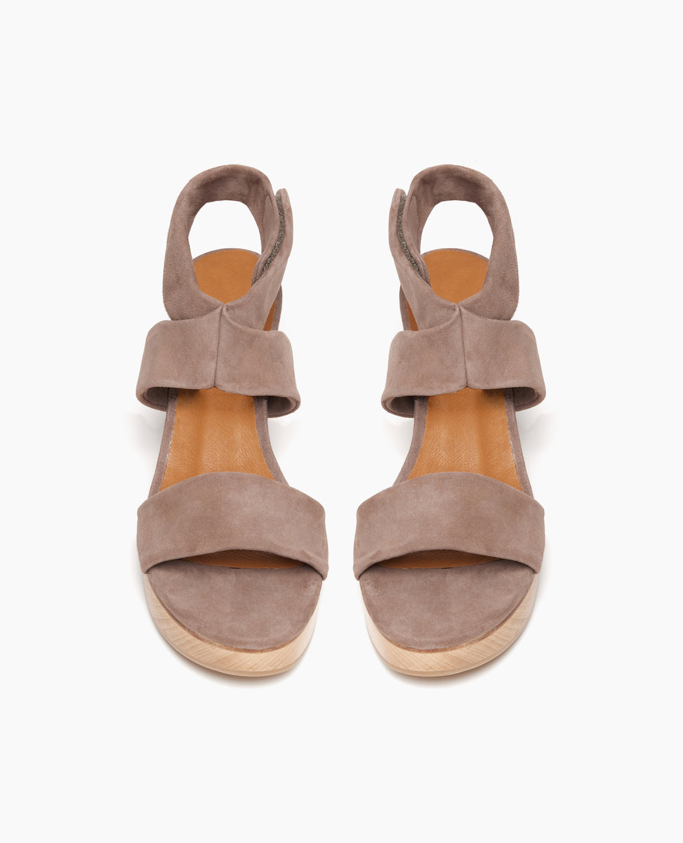 Top view shot of Coclico Robin Clog in Smoke suede: tubular band across foot, crisscrossed tubular ankle strap with a softly curved solid wood heel with matching solid wood platform. 
