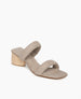 Coclico Sofiya Heel in Limestone nubuck a slide-on sandal with a low-height solid wood triangular heel, two padded leather straps across foot, angular toe and heel design - angle view.  2