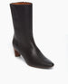Angled view Coclico Wakame Boot in Black Leather: a sophisticated snip-point-toe boot with an arched wood heel.  Inside zip closure.  8