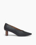 Side view of the Coclico Wumo Heel in Black/Coabi leather: a seasonless slip-on heel with a choked throat line, pointed toe, scultped oval shaped solid wood heel and subtle stichwork.  1