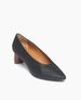Coclico Wumo Heel in Black/Coabi leather, angle view: a seasonless slip-on heel with a choked throat line, pointed toe, scultped oval shaped solid wood heel and subtle stichwork.  2