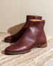 Sunlit close up of Coclico Egg Boot showing off its sublime Burgundy leather. 2