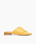 Coclico women's elegant flat slide with criss-cross leather straps in a vibrant sunshine yellow. Coclico shoes are sustainably made in Spain. 1