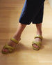 Close up of woman modeling Coclico Fanima Sandal in Torbolino leather a slide with tubular padded straps, squared-off toe and heel, flat feel. 4