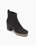 Coclico Ruba Clog in Black leather, angle view: Reimagined chelsea boot with stretch elastic gussets, leather pull tab, squared-off toe and a black mid-height solid wood heel. 2