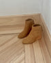 Coclico Lovage Boot in Wheat suede on wood flooring showing off softly rounded toe.  5
