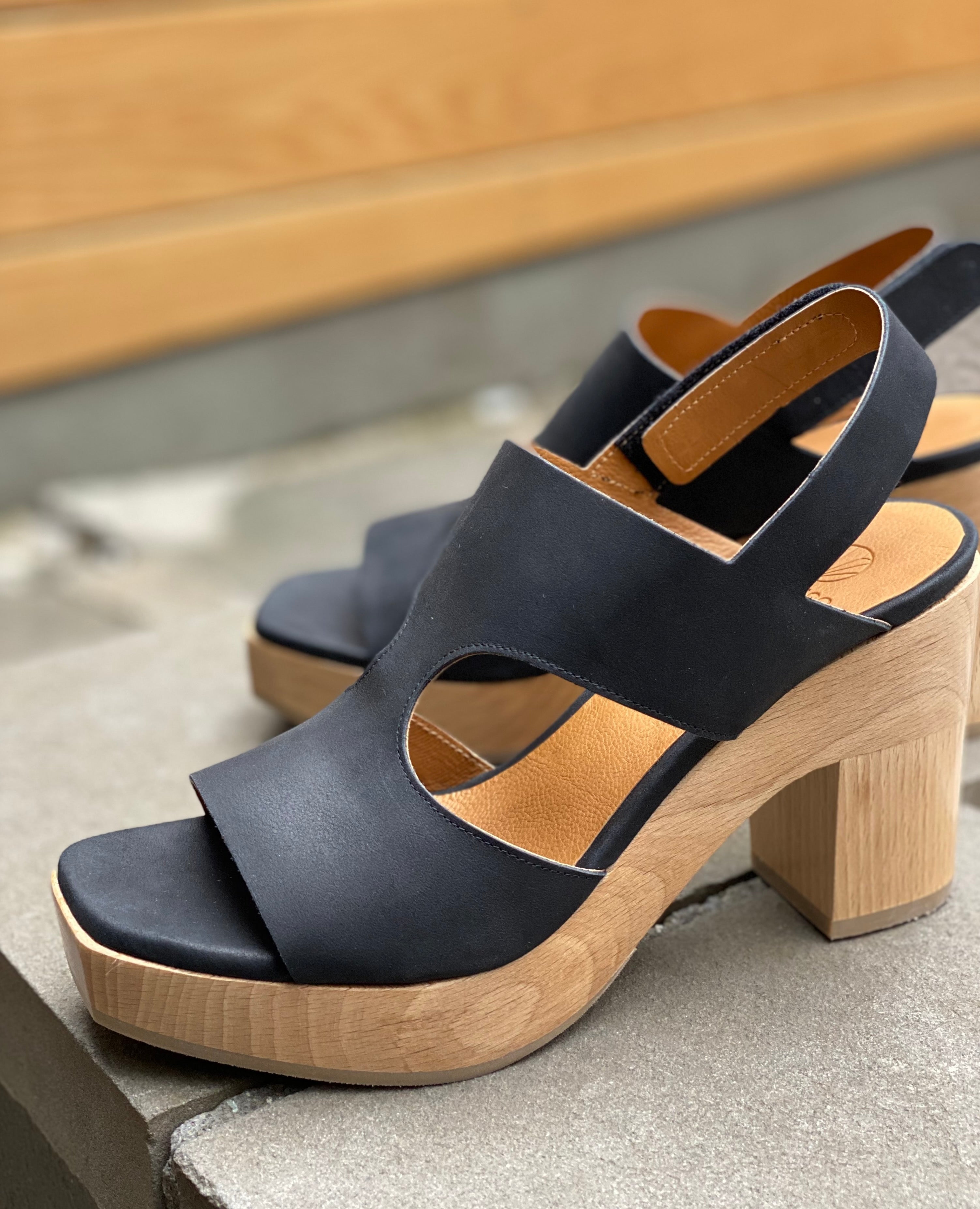 Close up sunlit shot of Coclico Vicky Clog in Black leather. 