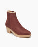 Coclico Keep Shearling Clog in Britannic leather, angle view: a shearling-lined clog with tapered, snipped toe, mid-height wood block platform, inside zip closure. 5