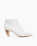 Coclico women's modern pointed-toe bootie in a stunning snake embossed white leather with a color-blocked wood heel. Coclico shoes are sustainably made in Spain. 1